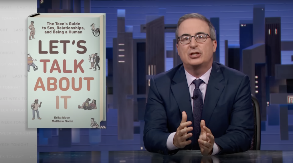 Screencap of John Oliver talking on his show, Last Week Tonight, next to a giant copy of LET'S TALK ABOUT IT, the teen sex and relationship book that Matthew Nolan and Erika Moen made.